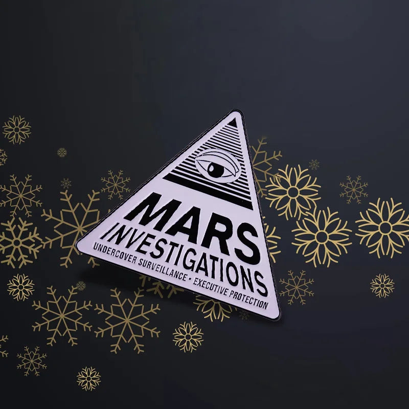 Broche con logotipo de Investigaciones de Veronica Mars