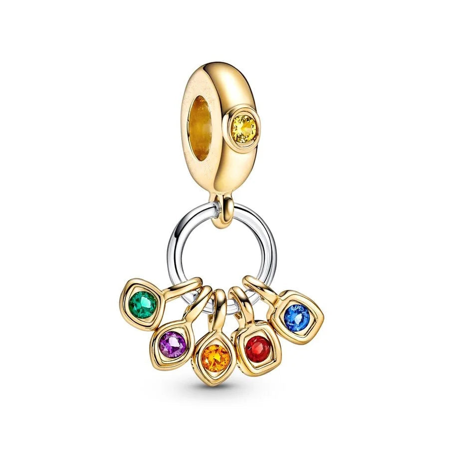 Gold charm with colorful gemstones on a white background.